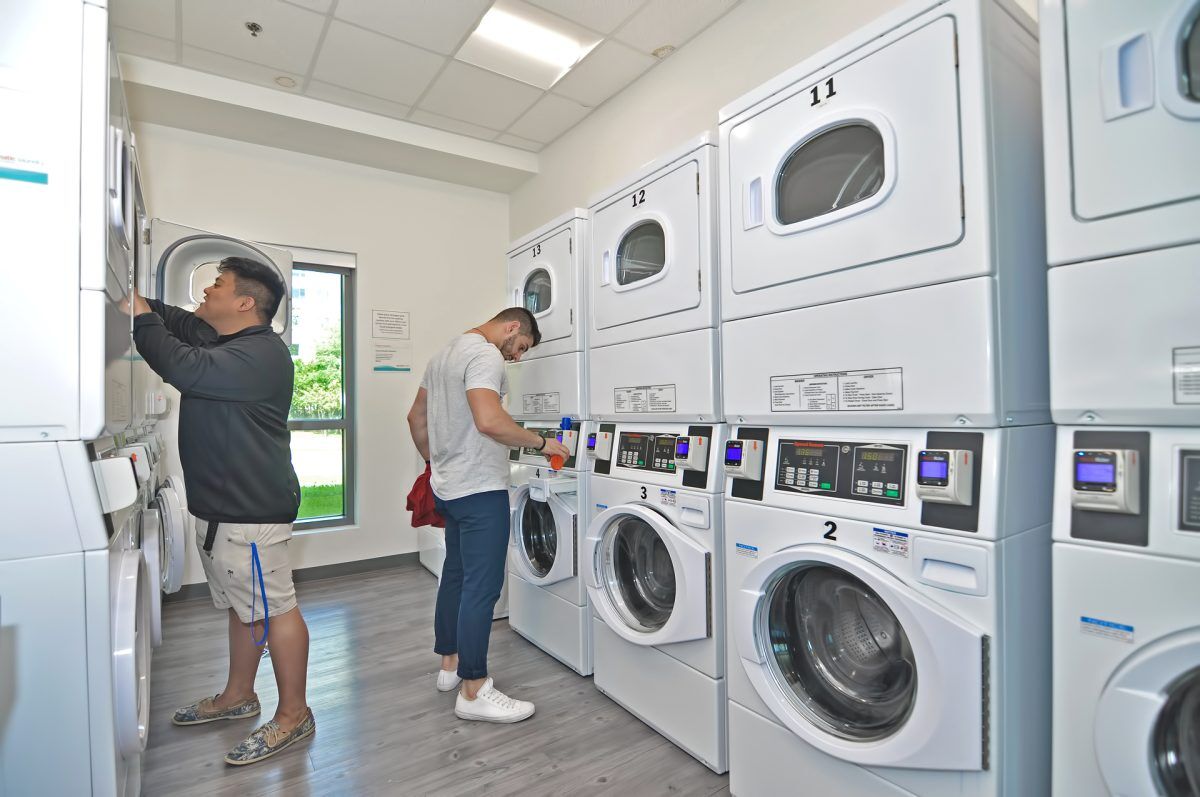 Residents using the laundry facilities
